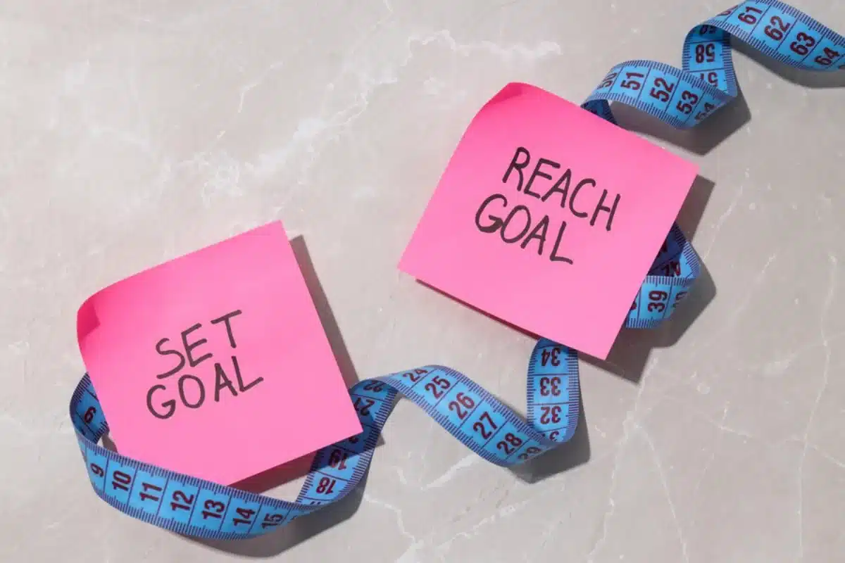 Two pink sticky notes with 